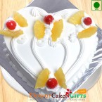send Half Kg Eggless Pineapple Cake Heart Shape delivery