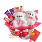 2 cute teddy bears n chocolates in basket