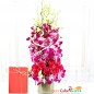 pink roses purple orchid in a vase