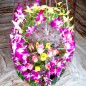 16 roses 7 purple orchids basket