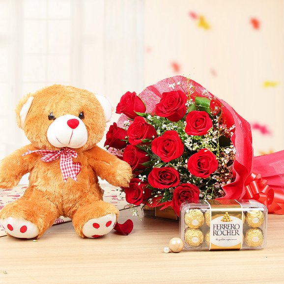 12 red roses bouquet 1 brown teddy 12 inch box of 16 ferrero rocher chocolates