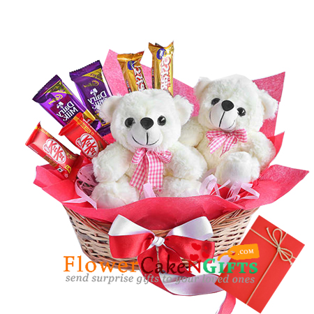 2 cute teddy bears n chocolates in basket