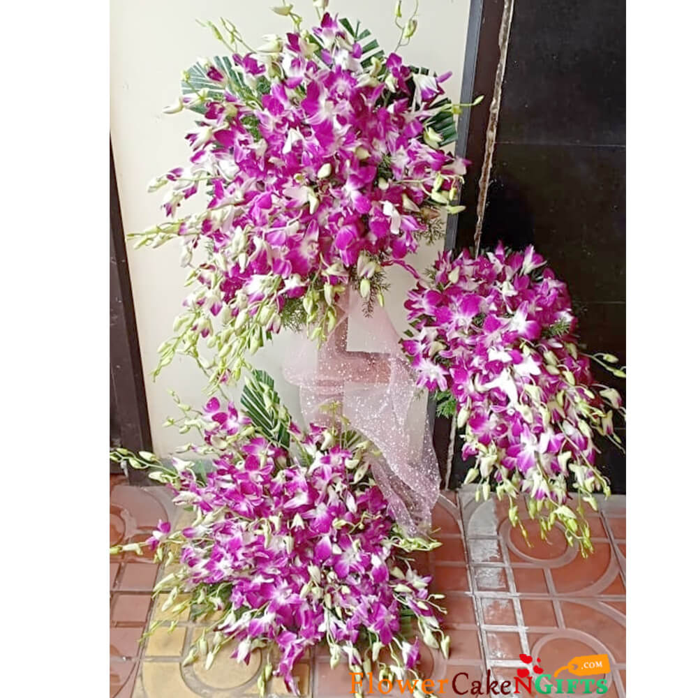 hearty purple orchid tall arrangement
