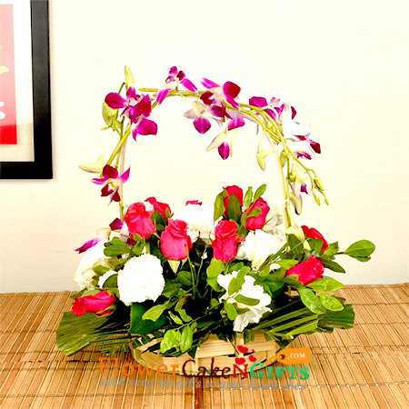 8 pink roses 8 white carnations 2 purple orchids in a basket