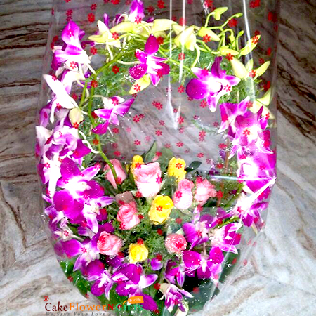 16 roses 7 purple orchids basket